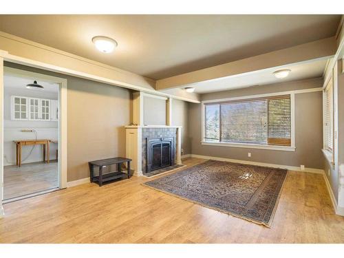 7787 Springbank Way Sw, Calgary, AB - Indoor With Fireplace