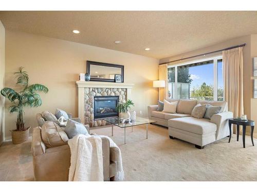 7787 Springbank Way Sw, Calgary, AB - Indoor Photo Showing Living Room With Fireplace