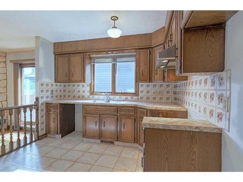 111 Oakmount Way Sw, Calgary, AB - Indoor Photo Showing Kitchen With Double Sink