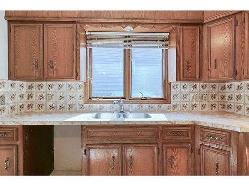 111 Oakmount Way Sw, Calgary, AB - Indoor Photo Showing Kitchen With Double Sink