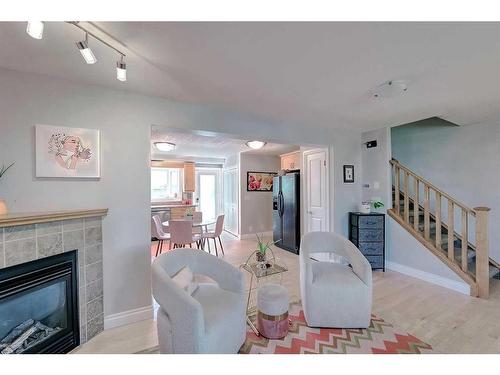 2417 53 Avenue Sw, Calgary, AB - Indoor Photo Showing Living Room With Fireplace