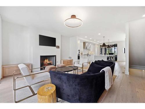 22 Alexandria Green Sw, Calgary, AB - Indoor Photo Showing Living Room With Fireplace