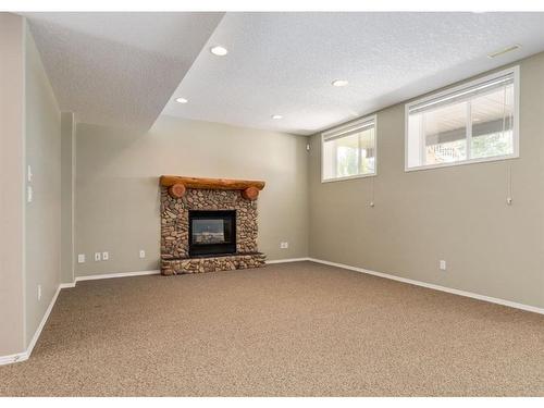 53 Strathlea Court Sw, Calgary, AB - Indoor Photo Showing Living Room With Fireplace