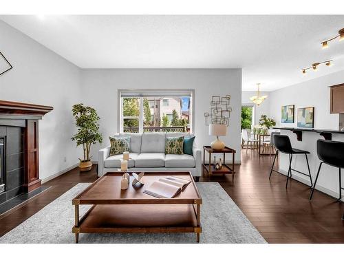 118 Aspen Hills Drive Sw, Calgary, AB - Indoor Photo Showing Living Room With Fireplace