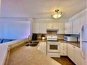 417-3000 Somervale Court Sw, Calgary, AB  - Indoor Photo Showing Kitchen With Double Sink 