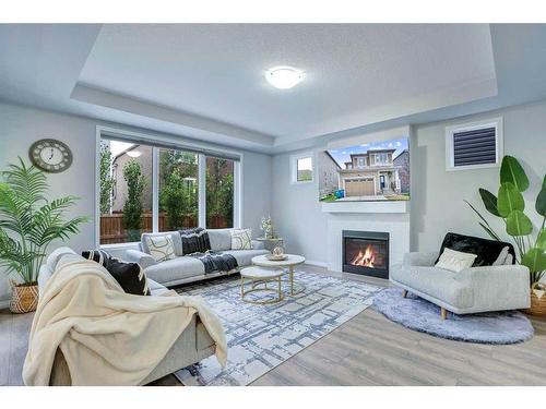 59 Osborne Common Sw, Airdrie, AB - Indoor Photo Showing Living Room With Fireplace