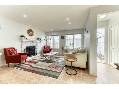 67 Cranford Crescent Se, Calgary, AB - Indoor Photo Showing Living Room With Fireplace