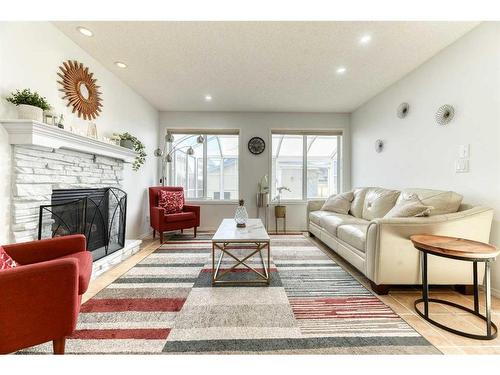 67 Cranford Crescent Se, Calgary, AB - Indoor Photo Showing Living Room With Fireplace