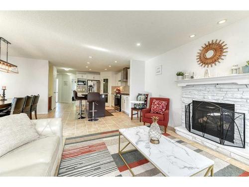 67 Cranford Crescent Se, Calgary, AB - Indoor Photo Showing Living Room With Fireplace