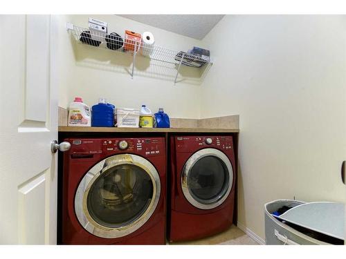 67 Cranford Crescent Se, Calgary, AB - Indoor Photo Showing Laundry Room