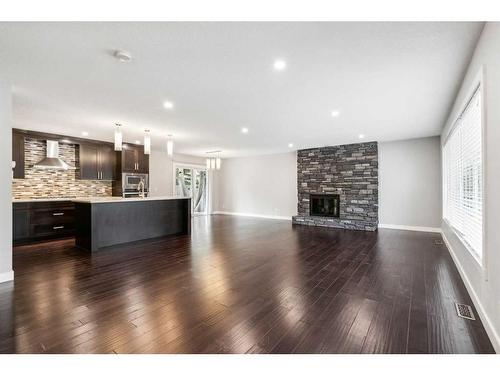 75 Chelsea Street Nw, Calgary, AB - Indoor Photo Showing Living Room With Fireplace