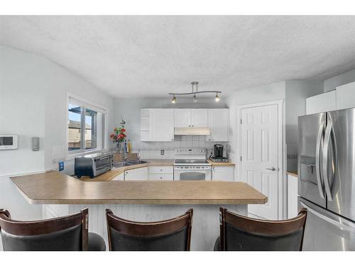 28 Taralea Gardens Ne, Calgary, AB - Indoor Photo Showing Kitchen With Double Sink