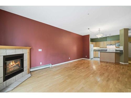 210-5201 Dalhousie Drive Nw, Calgary, AB - Indoor With Fireplace