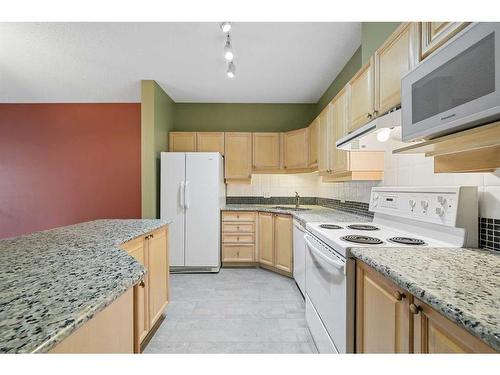 210-5201 Dalhousie Drive Nw, Calgary, AB - Indoor Photo Showing Kitchen