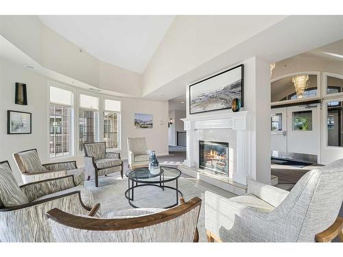 210-5201 Dalhousie Drive Nw, Calgary, AB - Indoor Photo Showing Living Room With Fireplace