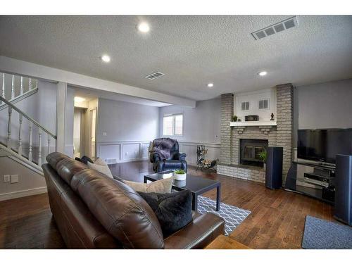 2513 Douglas Woods Link Se, Calgary, AB - Indoor Photo Showing Other Room With Fireplace