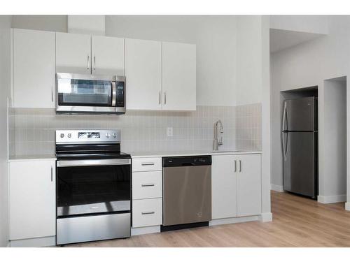 149 Magnolia Terrace Se, Calgary, AB - Indoor Photo Showing Kitchen With Stainless Steel Kitchen With Upgraded Kitchen