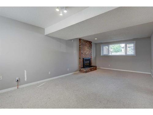 171 Bracewood Way Sw, Calgary, AB - Indoor With Fireplace