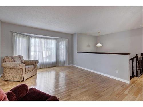 171 Bracewood Way Sw, Calgary, AB - Indoor Photo Showing Living Room