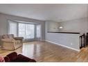 171 Bracewood Way Sw, Calgary, AB  - Indoor Photo Showing Living Room 