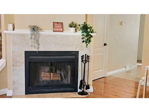 167 Woodborough Terrace Sw, Calgary, AB - Indoor Photo Showing Living Room With Fireplace