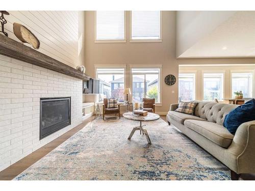 65 Auburn Shores Cape Se, Calgary, AB - Indoor Photo Showing Living Room With Fireplace