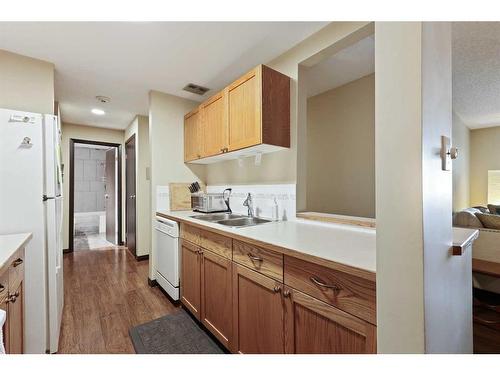 212-550 Westwood Drive Sw, Calgary, AB - Indoor Photo Showing Kitchen With Double Sink