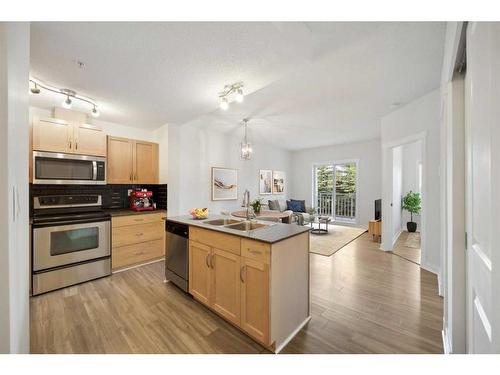 2306-5605 Henwood Street Sw, Calgary, AB - Indoor Photo Showing Kitchen With Double Sink