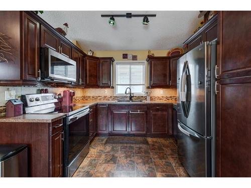 14981 5 Street Sw, Calgary, AB - Indoor Photo Showing Kitchen With Double Sink