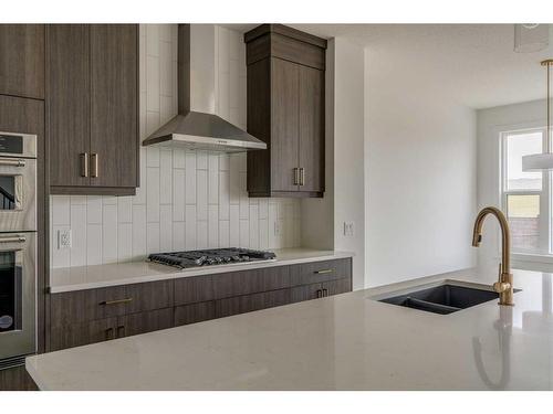 1198 Chinook Winds Circle Sw, Airdrie, AB - Indoor Photo Showing Kitchen With Double Sink With Upgraded Kitchen