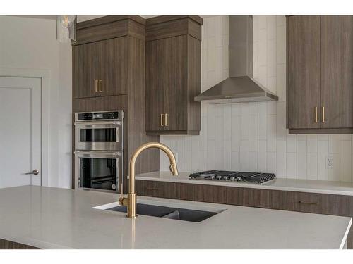 1198 Chinook Winds Circle Sw, Airdrie, AB - Indoor Photo Showing Kitchen With Double Sink