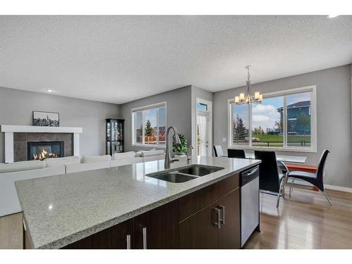 96 Redstone Parade Ne, Calgary, AB - Indoor Photo Showing Other Room With Fireplace