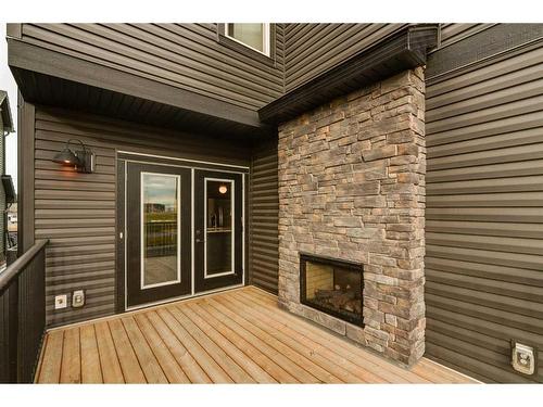 1313 Chinook Gate Green Sw, Airdrie, AB - Outdoor With Fireplace With Exterior