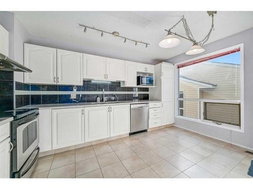 135 Prominence Heights Sw, Calgary, AB - Indoor Photo Showing Kitchen With Stainless Steel Kitchen