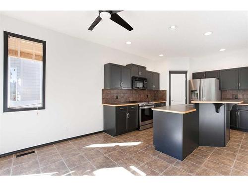 420 Eversyde Way Sw, Calgary, AB - Indoor Photo Showing Kitchen With Stainless Steel Kitchen With Upgraded Kitchen