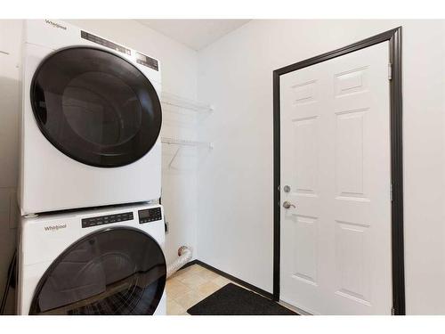 420 Eversyde Way Sw, Calgary, AB - Indoor Photo Showing Laundry Room