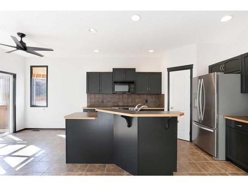 420 Eversyde Way Sw, Calgary, AB - Indoor Photo Showing Kitchen With Stainless Steel Kitchen With Double Sink