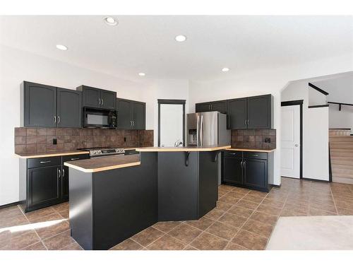 420 Eversyde Way Sw, Calgary, AB - Indoor Photo Showing Kitchen With Stainless Steel Kitchen With Upgraded Kitchen