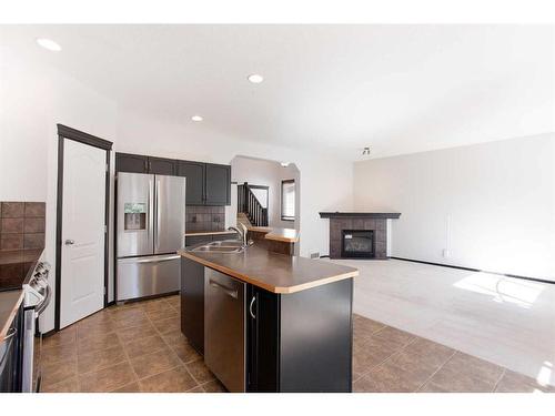 420 Eversyde Way Sw, Calgary, AB - Indoor Photo Showing Kitchen With Stainless Steel Kitchen With Double Sink