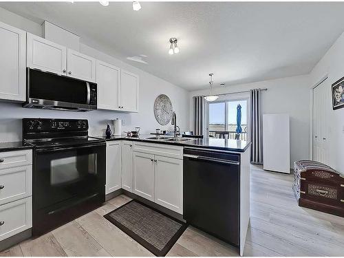 356 Sunrise Terrace Ne, High River, AB - Indoor Photo Showing Kitchen With Double Sink