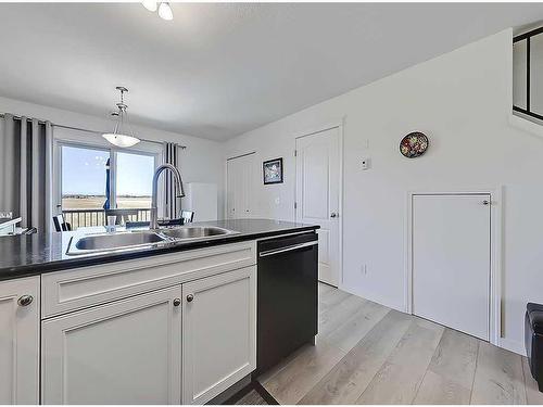 356 Sunrise Terrace Ne, High River, AB - Indoor Photo Showing Kitchen With Double Sink