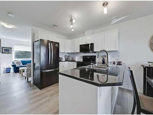 356 Sunrise Terrace Ne, High River, AB - Indoor Photo Showing Kitchen With Stainless Steel Kitchen With Double Sink