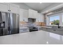 191 Scenic Way Nw, Calgary, AB  - Indoor Photo Showing Kitchen With Double Sink With Upgraded Kitchen 