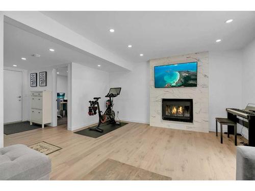 52 Woodstock Way Sw, Calgary, AB - Indoor With Fireplace