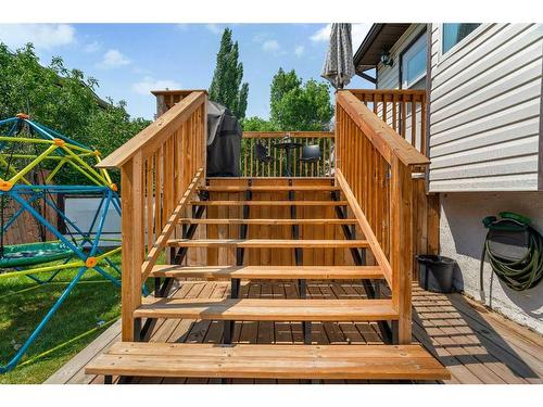 52 Woodstock Way Sw, Calgary, AB - Outdoor With Deck Patio Veranda With Exterior