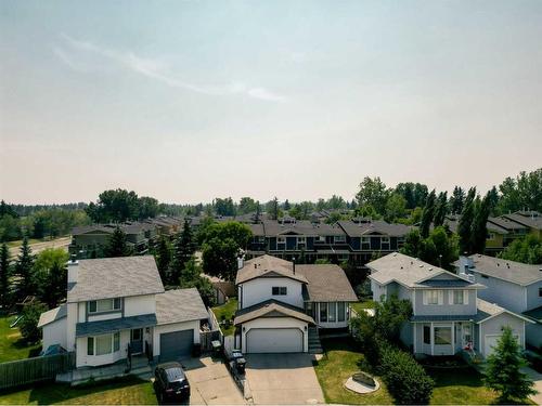 52 Woodstock Way Sw, Calgary, AB - Outdoor With Facade