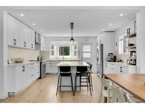 52 Woodstock Way Sw, Calgary, AB - Indoor Photo Showing Kitchen With Upgraded Kitchen