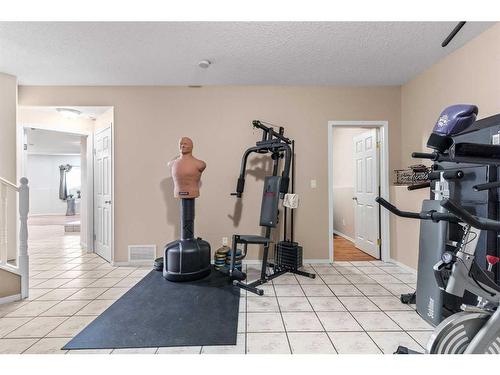 317 Carriage Lane Drive, Carstairs, AB - Indoor Photo Showing Gym Room