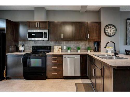 170 New Brighton Point Se, Calgary, AB - Indoor Photo Showing Kitchen With Double Sink With Upgraded Kitchen