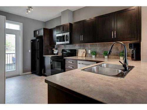 170 New Brighton Point Se, Calgary, AB - Indoor Photo Showing Kitchen With Double Sink